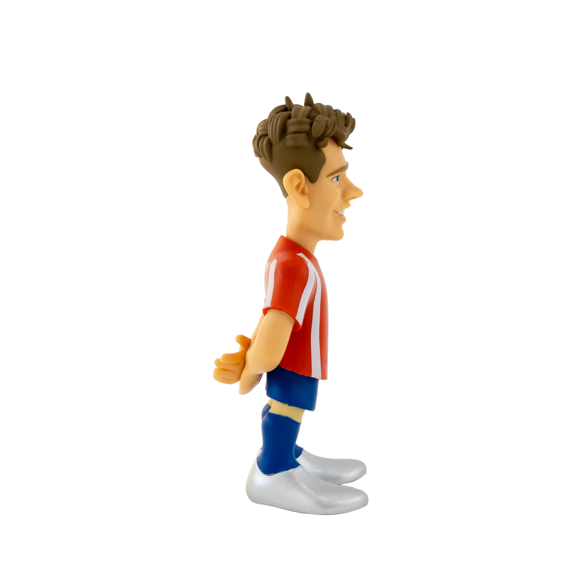 Minix Antoine Griezmann collectible figurine with sculpted brown hair, red-and-white striped shirt, blue shorts and socks, and white boots.