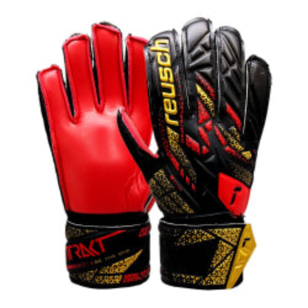 Reusch Attrakt Solid Junior Goalkeeper Gloves with red palm, black and gold backhand, full strap closure, and breathable materials for durability and comfort.