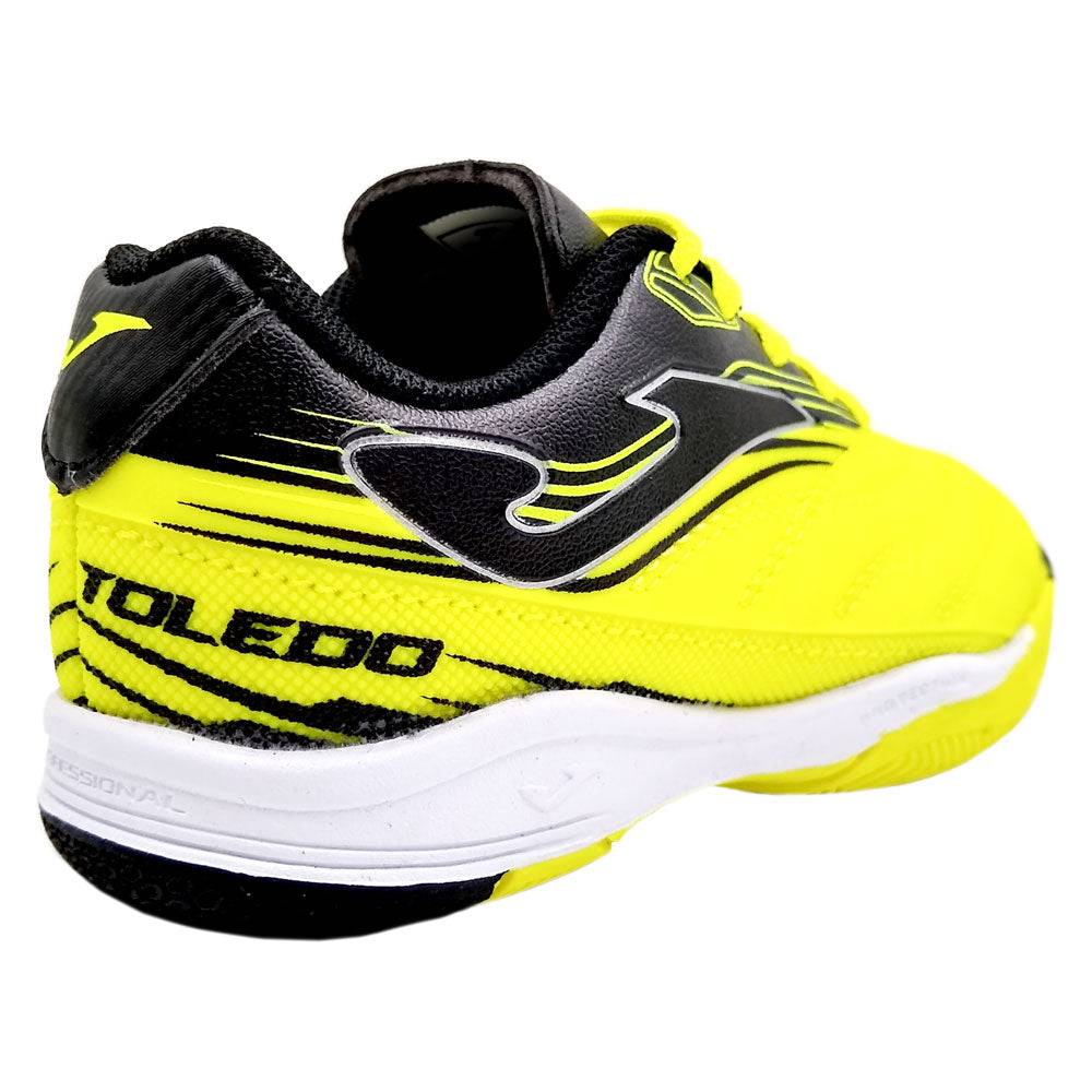 Joma Toledo Junior Indoor Soccer Shoes in vibrant yellow and black, designed for style and comfort.