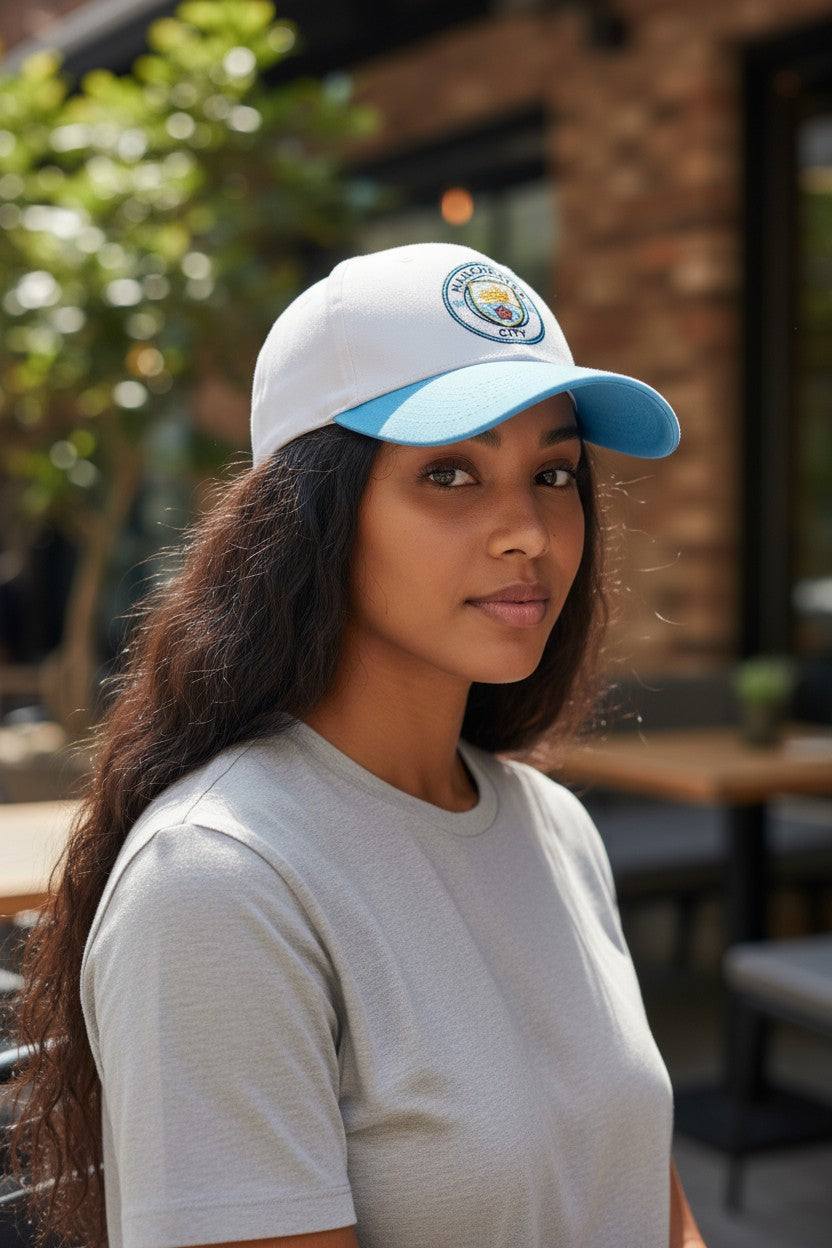 Woman wearing Fan Ink officially licensed 2-tone adjustable Football Hat with Manchester City emblem