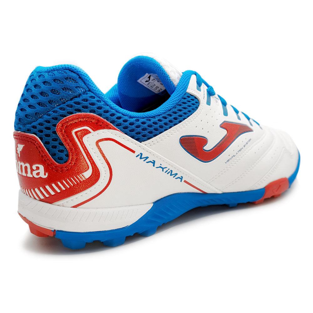 Joma Maxima adult turf soccer shoe in white, blue, and red with studded sole for superior traction and lightweight performance