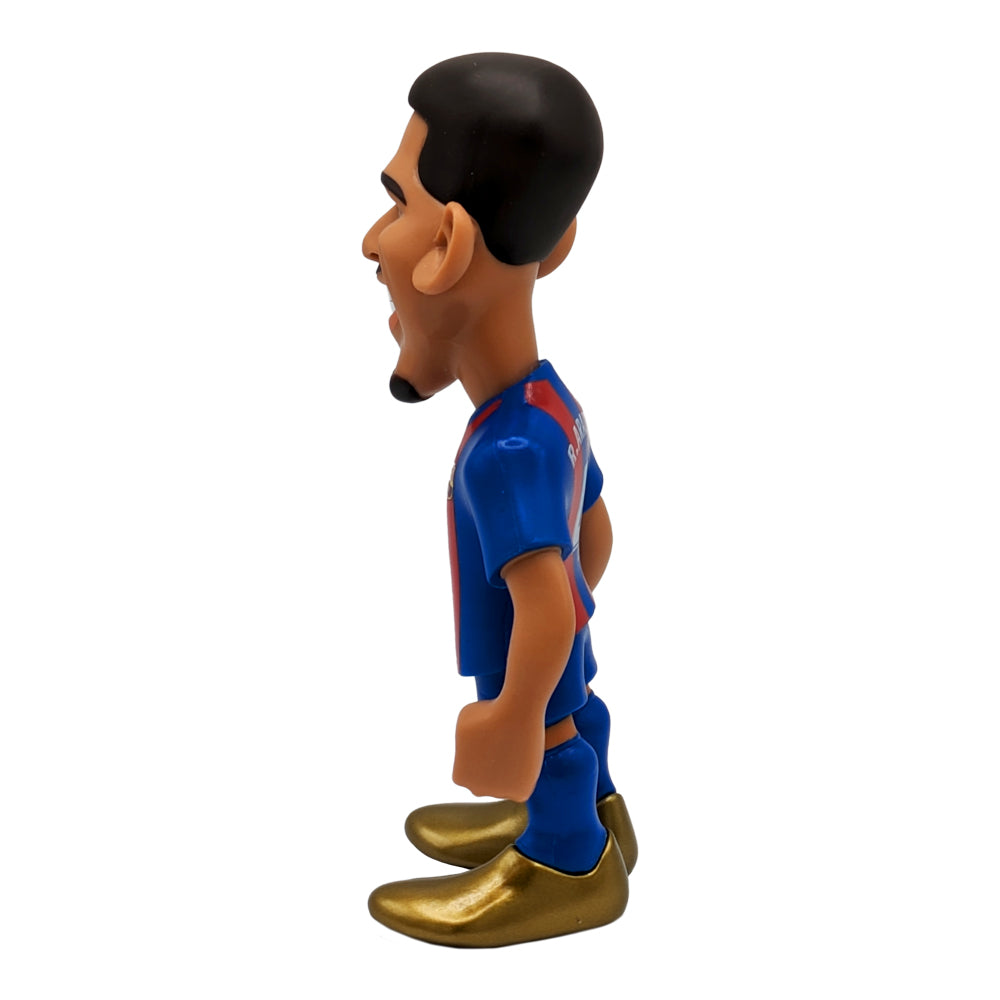 Football figurine in a blue and red FC Barcelona kit with a sculpted hairstyle and metallic gold boots, Minix Ronald Araújo FC Barcelona collectible.