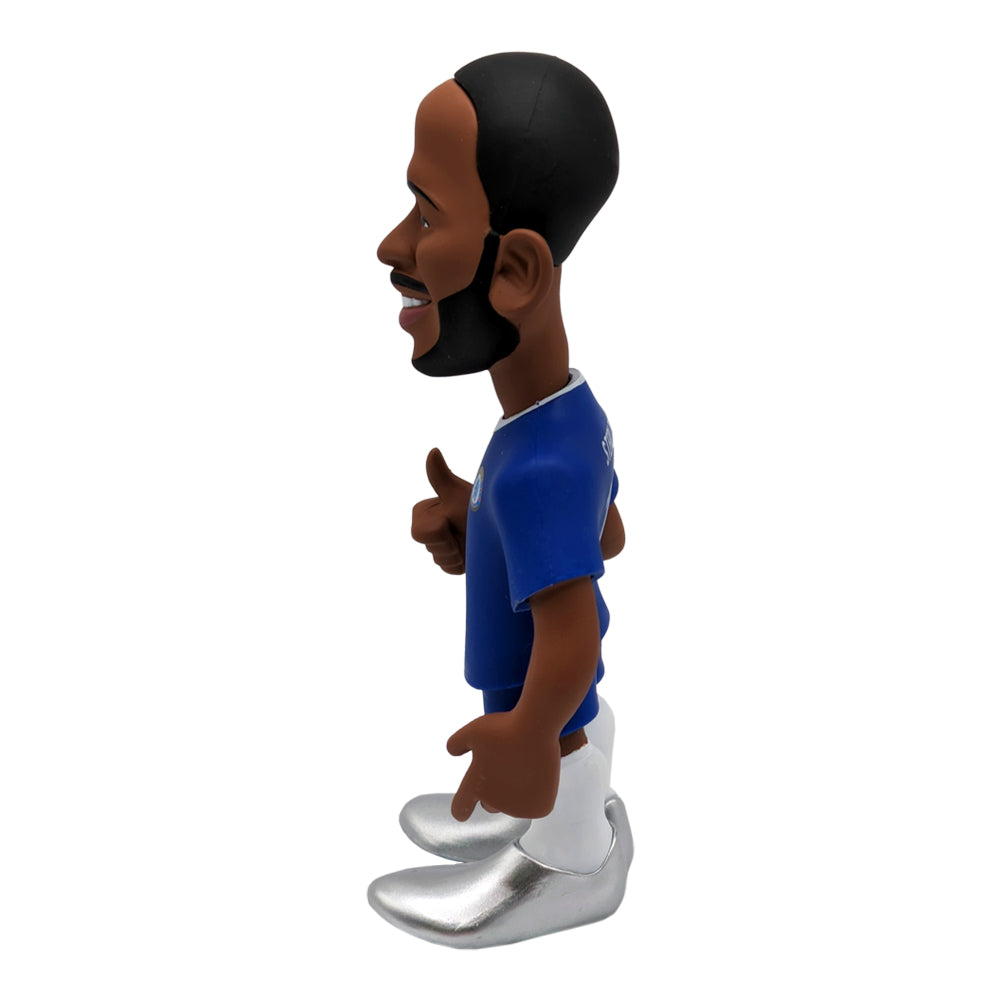 Minix Raheem Sterling Chelsea figurine with a blue shirt, white shorts, oversized silver boots and a sculpted beard.