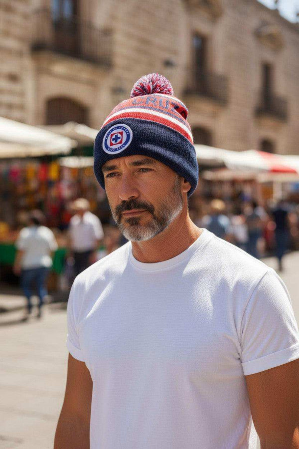 Cruz Azul Cuffed Beanie in navy, red and white striped knit, with a pom-pom and circular team crest