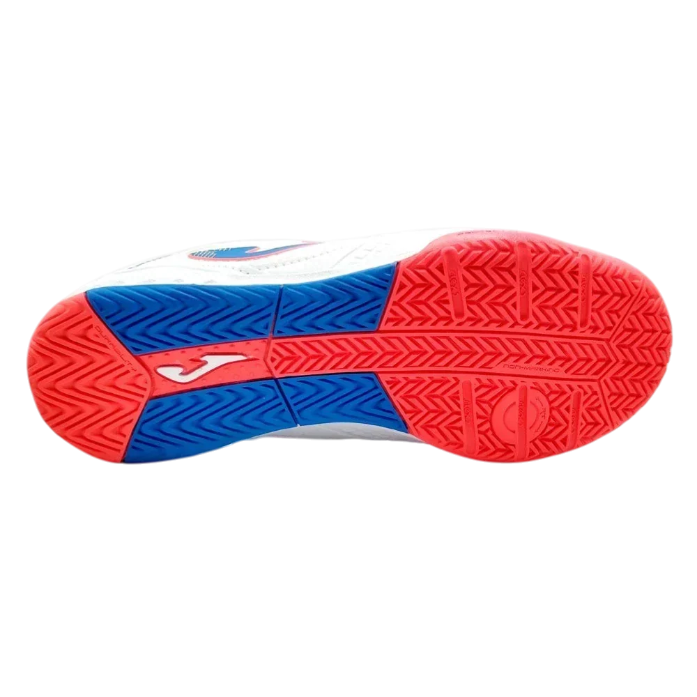 Joma Dribling indoor soccer shoe outsole in red and blue rubber with textured traction patterns and white Joma logo