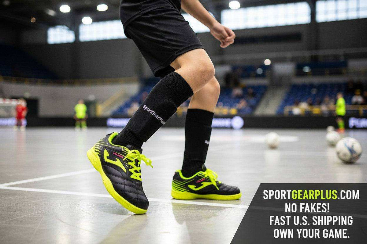 Joma Toledo indoor soccer shoes in black with neon yellow accents, worn by a player on a court