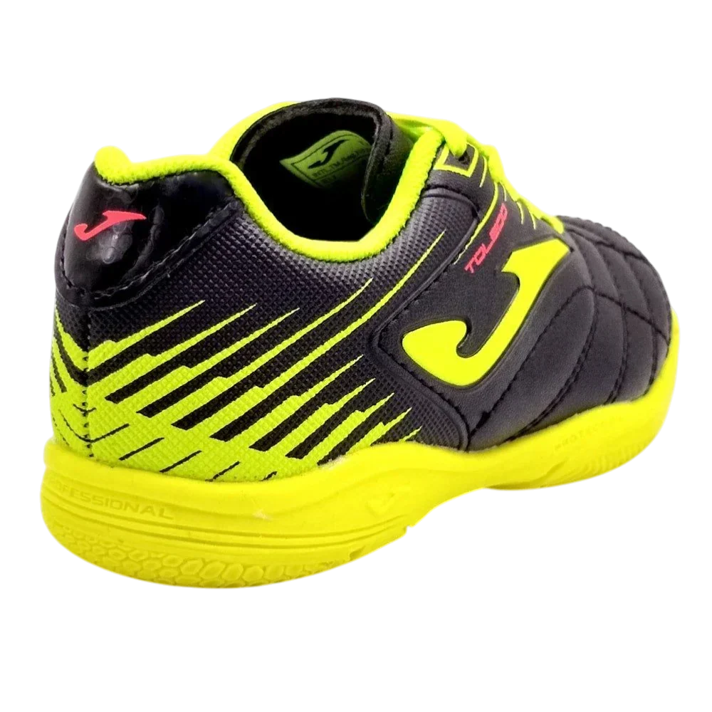 Joma Toledo junior indoor soccer shoe in black and neon yellow with synthetic panels, striped heel and Joma logo
