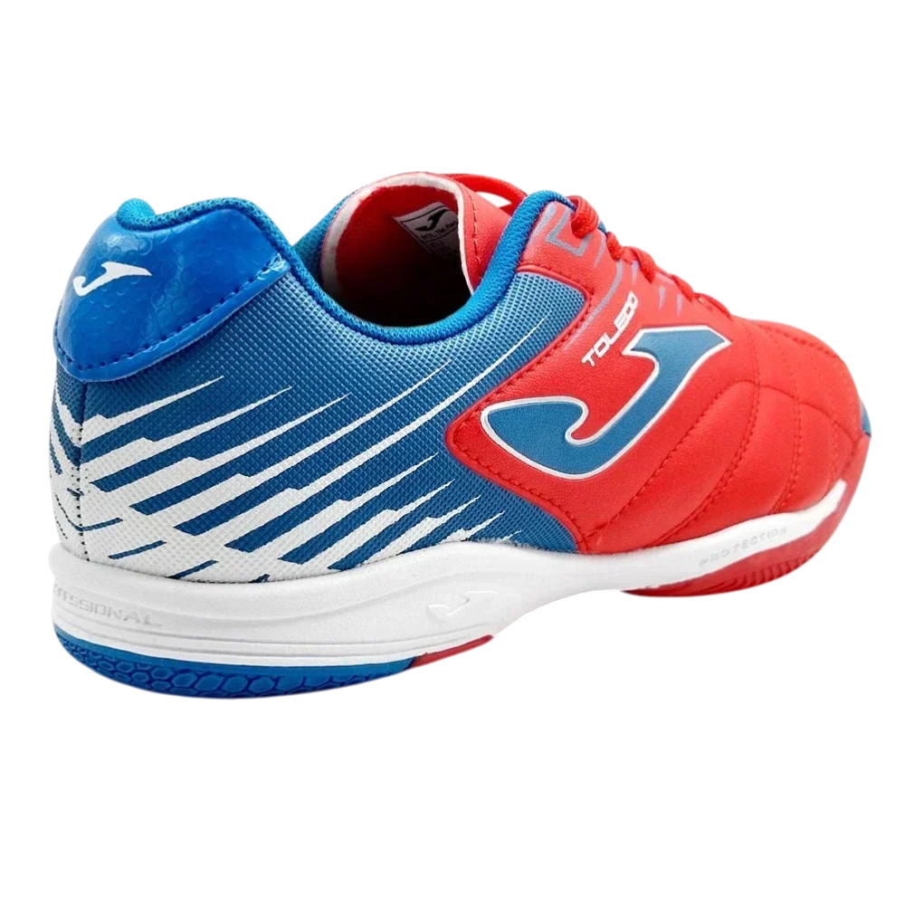 Joma Toledo junior indoor soccer shoe in red, blue and white with a striped design and flat rubber outsole