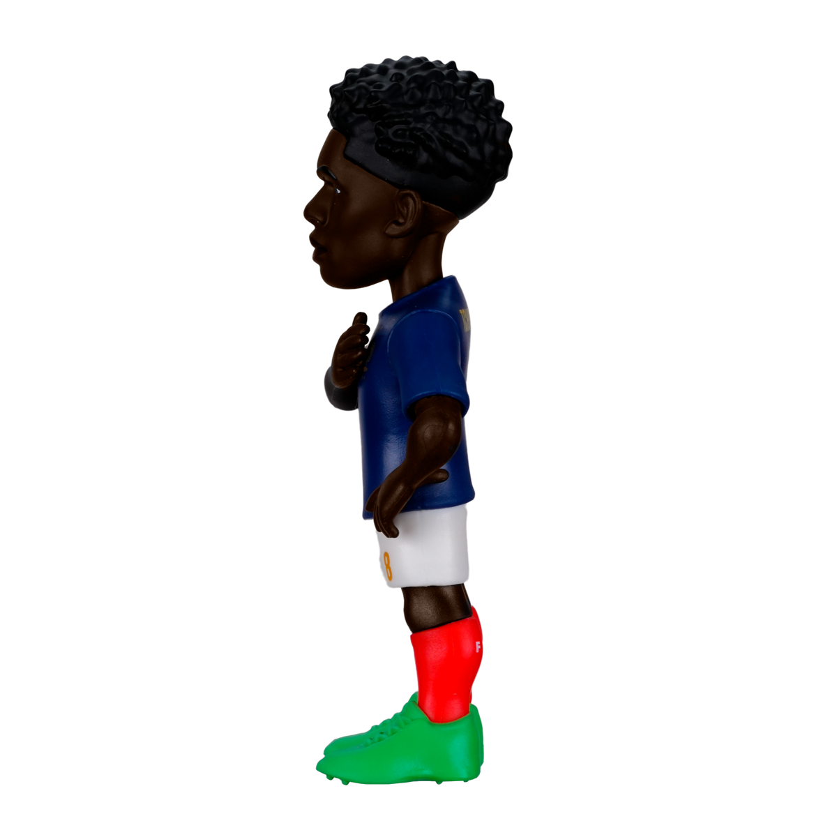 Minix Aurélien Tchouaméni figurine with dark curly hair, blue jersey, white shorts, and bright red and green socks