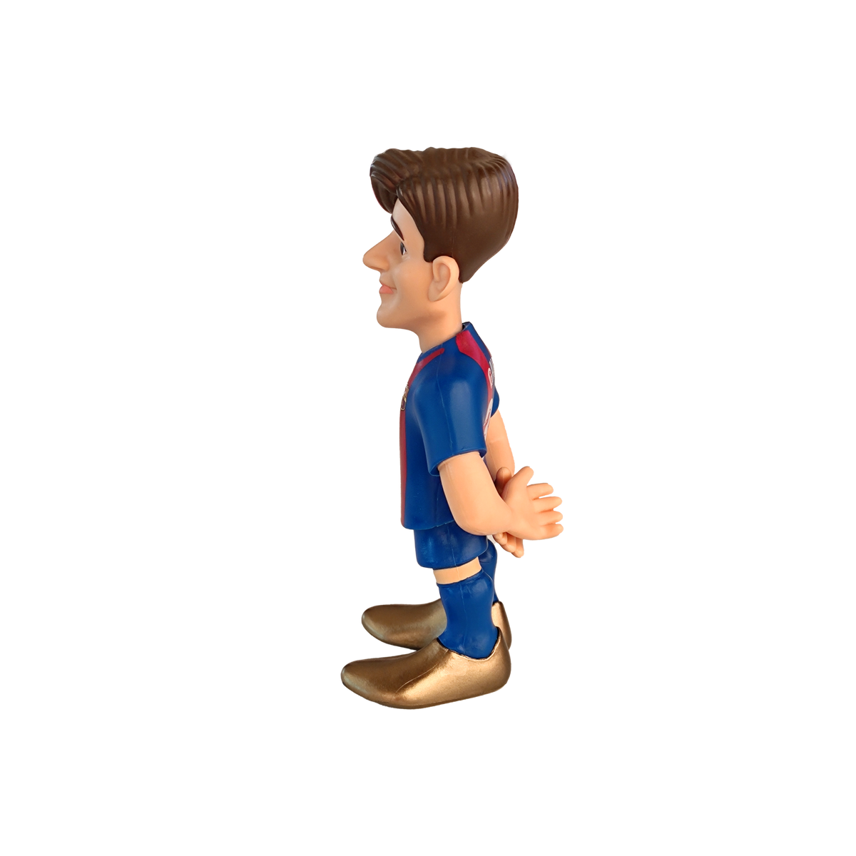Minix Gavi FC Barcelona figurine in a blue kit with red accents, brown hair and oversized gold shoes