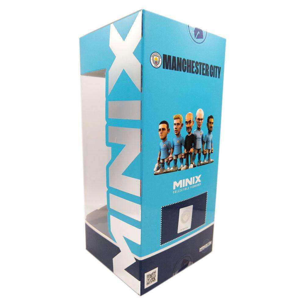 Minix Kevin De Bruyne Manchester City collectible in a turquoise display box featuring player figurines and team branding