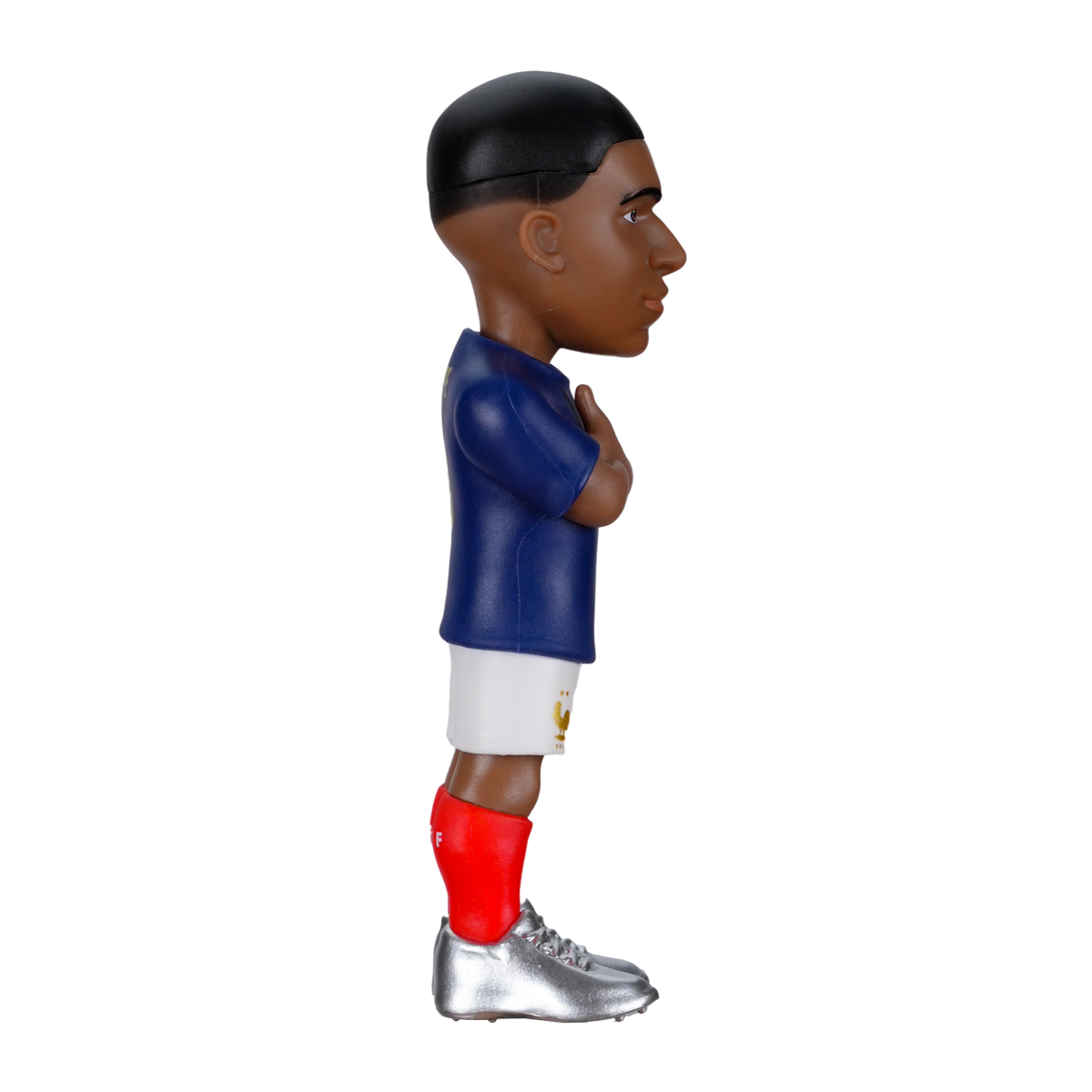 Minix Kylian Mbappé football figurine in a navy blue shirt, white shorts, red socks and silver boots