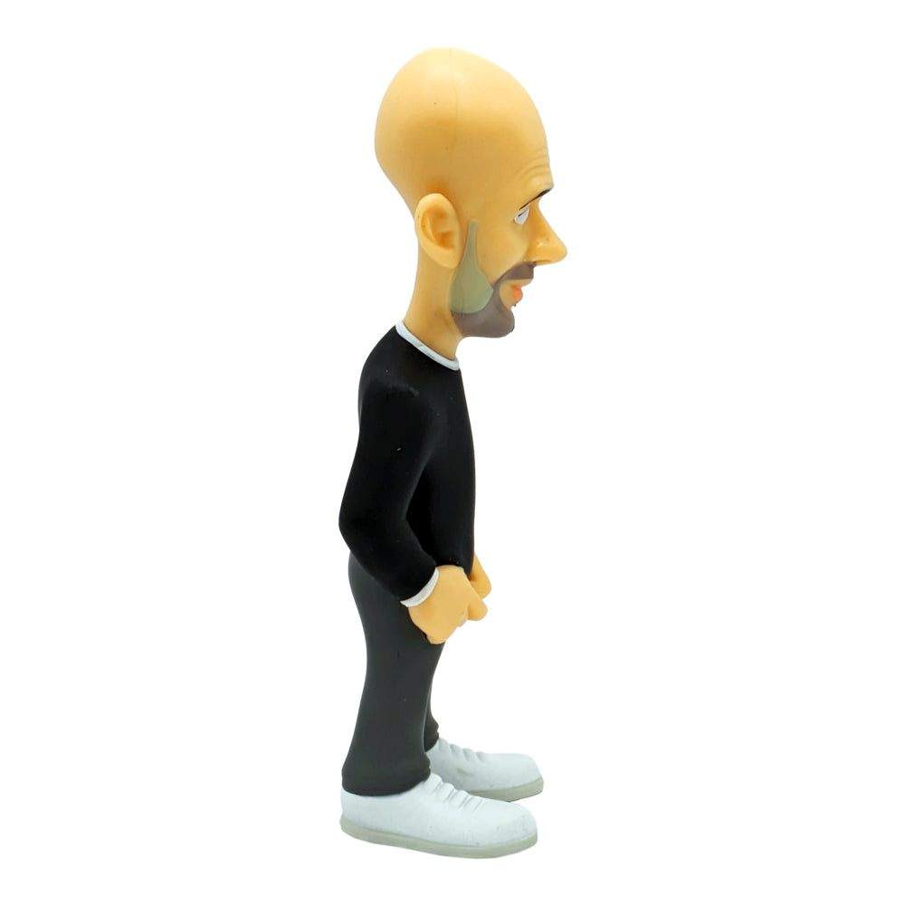 Minix Pep Guardiola Manchester City figurine with a bald sculpt, black long-sleeved outfit, dark trousers and white trainers
