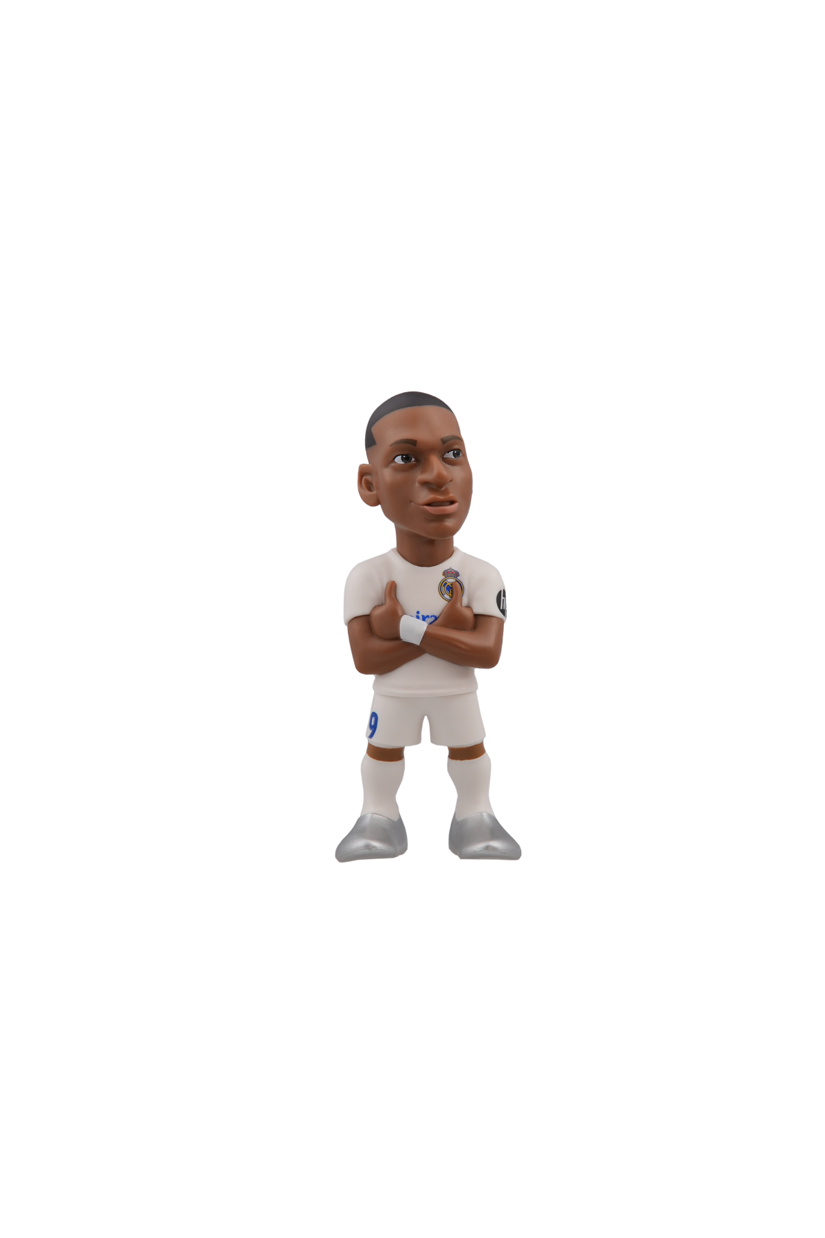 Minix football figurine in a white Real Madrid kit with crossed arms, dark hair and grey boots