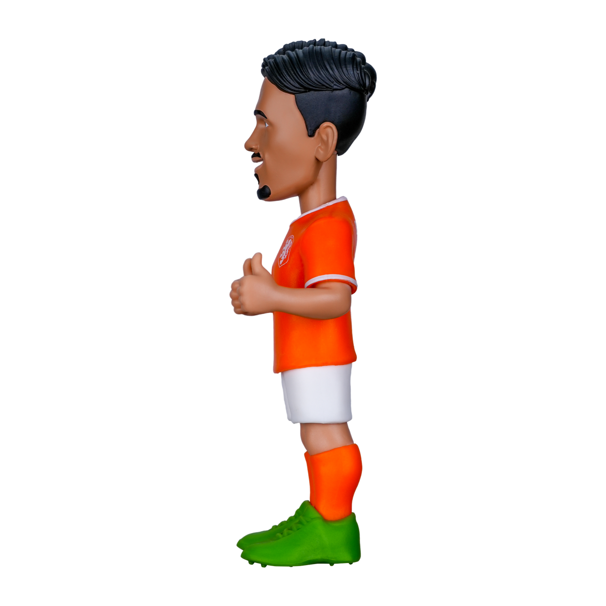 Minix Tijjani Reijnders figurine with black swept hair, wearing an orange Netherlands shirt, white shorts and green boots