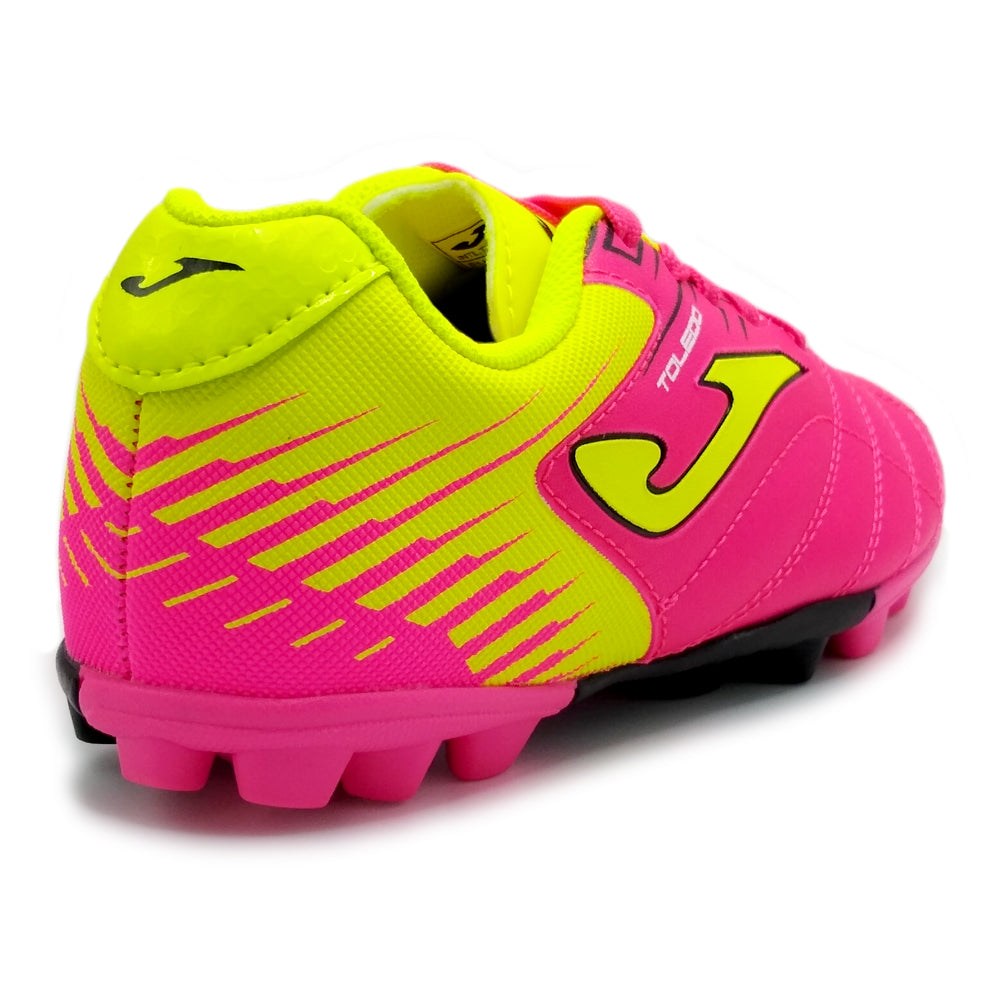 Joma Toledo Junior Molded 24 Soccer Shoes with pink and yellow design, showing rubber outsole for traction.