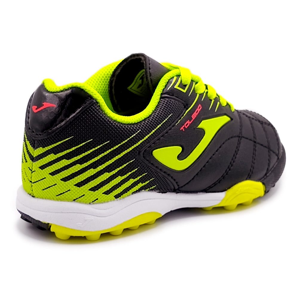 Joma Toledo Junior Kids Turf Soccer Shoes in black and neon green, designed for grip and comfort on artificial surfaces.