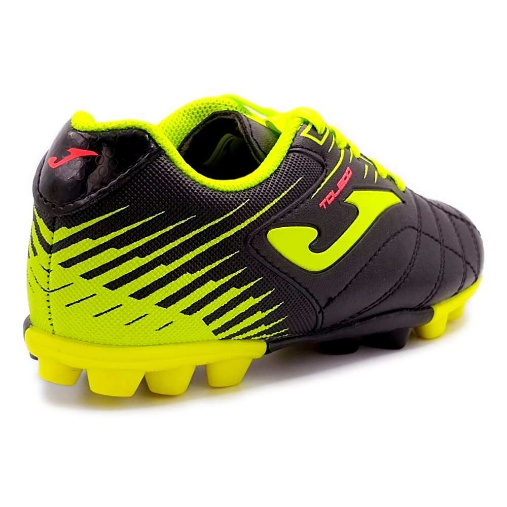Black Joma junior firm ground soccer cleats with lightweight synthetic upper and multi-surface outsole