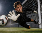 Reusch Attrakt Advance Junior Goalkeeper Gloves in black and orange with Reusch Grip Advance latex for reliable grip and finger support