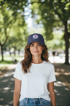 Woman wearing Fan Ink officially licensed adjustable hat for top clubs outdoors