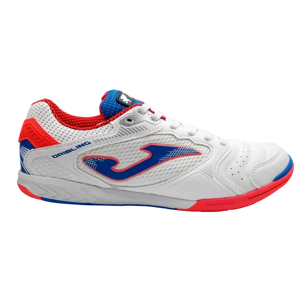 Joma Dribling indoor soccer shoe in white synthetic material with blue and red accents, textured upper and flat rubber sole