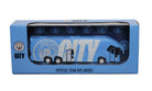 Manchester City Mini Team Bus collectible featuring a blue miniature coach with City branding and white lettering in a display box