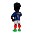 Minix Aurélien Tchouaméni figurine shown from behind in a blue number 8 shirt, white shorts, red socks and green boots
