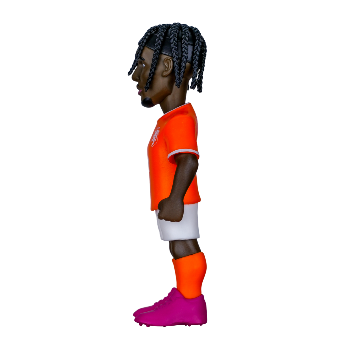 Minix Jeremie Frimpong figurine in an orange Netherlands shirt, white shorts and magenta boots, with braided hair