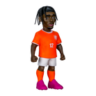 Minix Jeremie Frimpong figurine in an orange Netherlands number 12 kit, with braided hair and bright pink boots