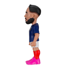 Minix Rayan Cherki figurine in a blue shirt, white shorts, red socks and bright pink boots, with sculpted dark hair and beard